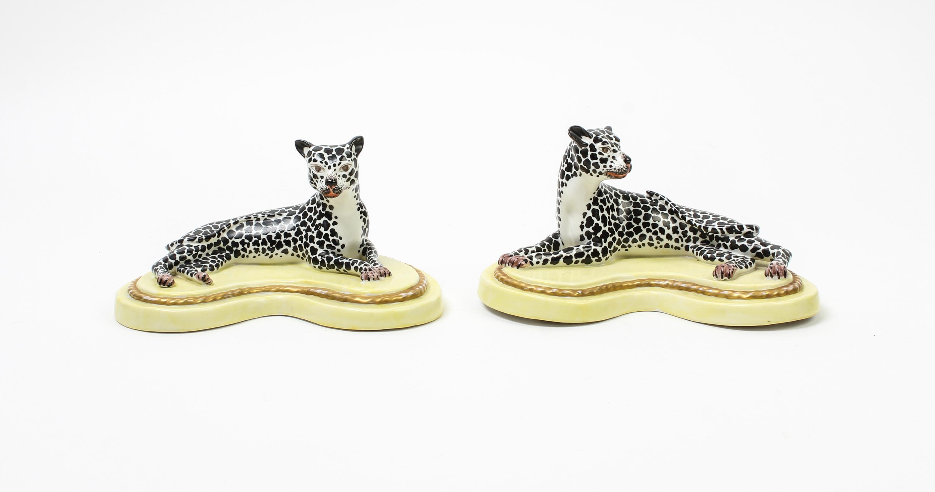 A Pair of Porcelain Models of Recumbent Cheetahs Width 7 3/4 inches. — 20TH CENTURY