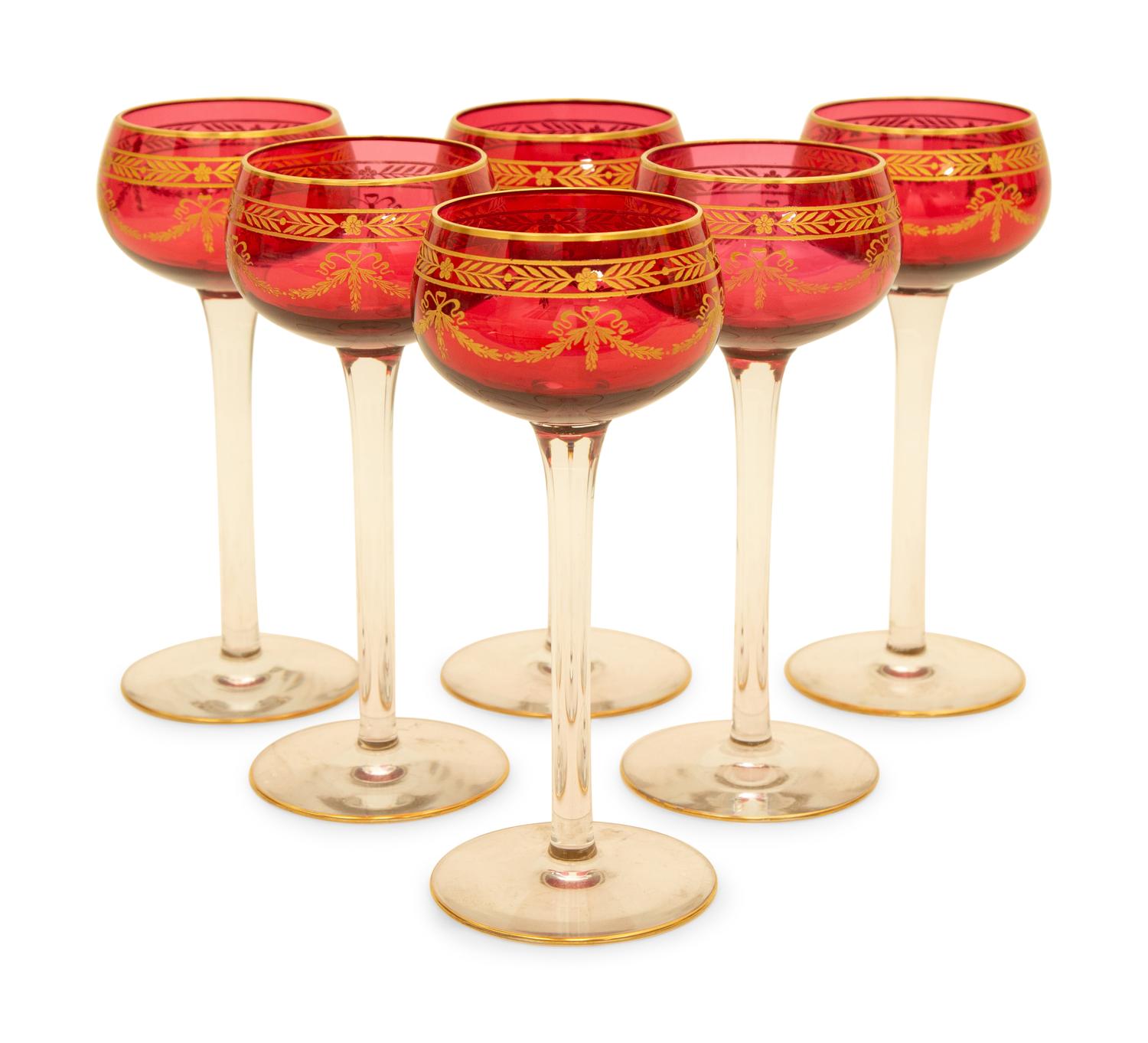 A Set of Twelve Bohemian Gilt Decorated Cranberry Glass Stemmed White Wines — 19th/20th Century