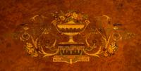 A Louis XVI Style Gilt Bronze Mounted Amboyna and Marquetry Center Table