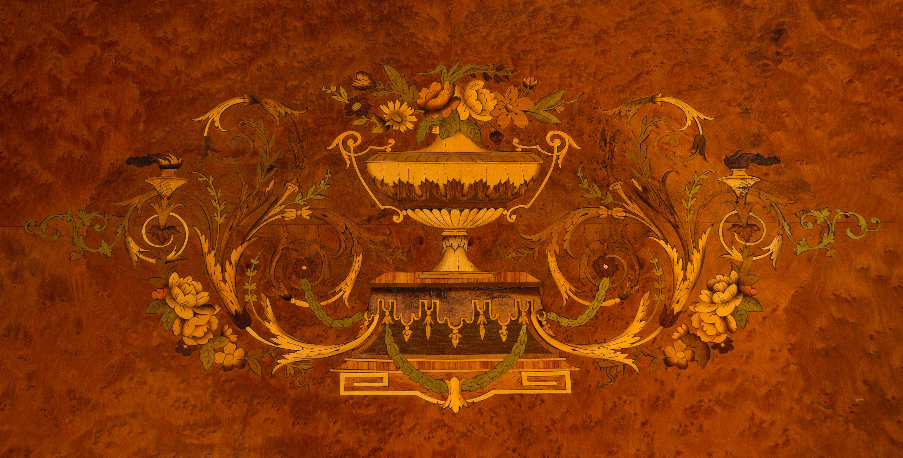 A Louis XVI Style Gilt Bronze Mounted Amboyna and Marquetry Center Table
