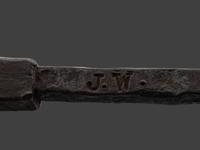 A Forged and Hammered Iron Figural Chestnut Roaster