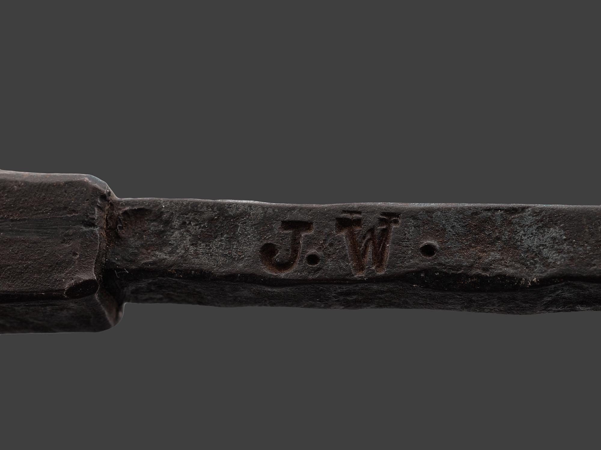 A Forged and Hammered Iron Figural Chestnut Roaster