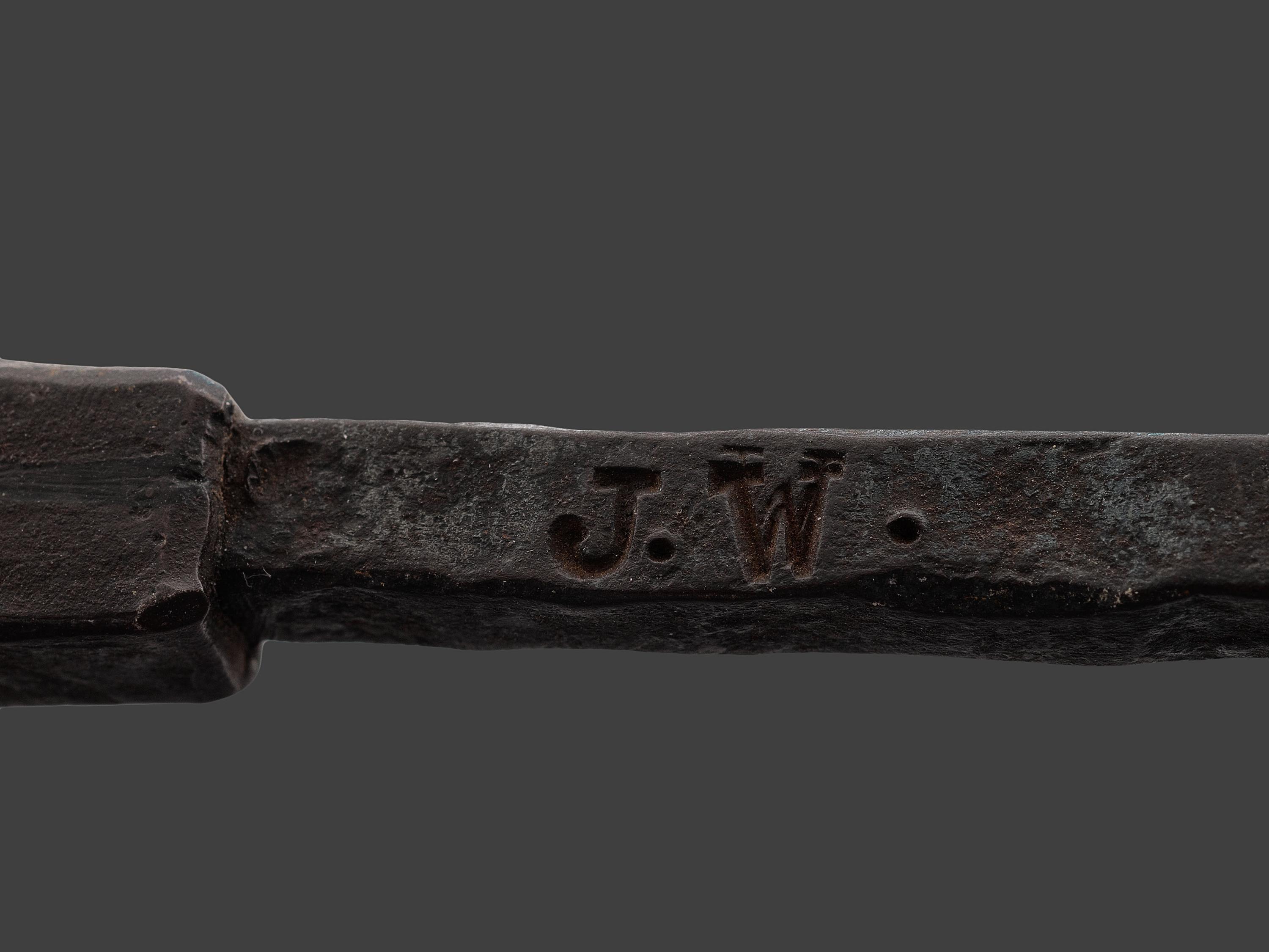 A Forged and Hammered Iron Figural Chestnut Roaster