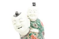 A Chinese Famille Verte Biscuit Porcelain 'Piggyback' Group