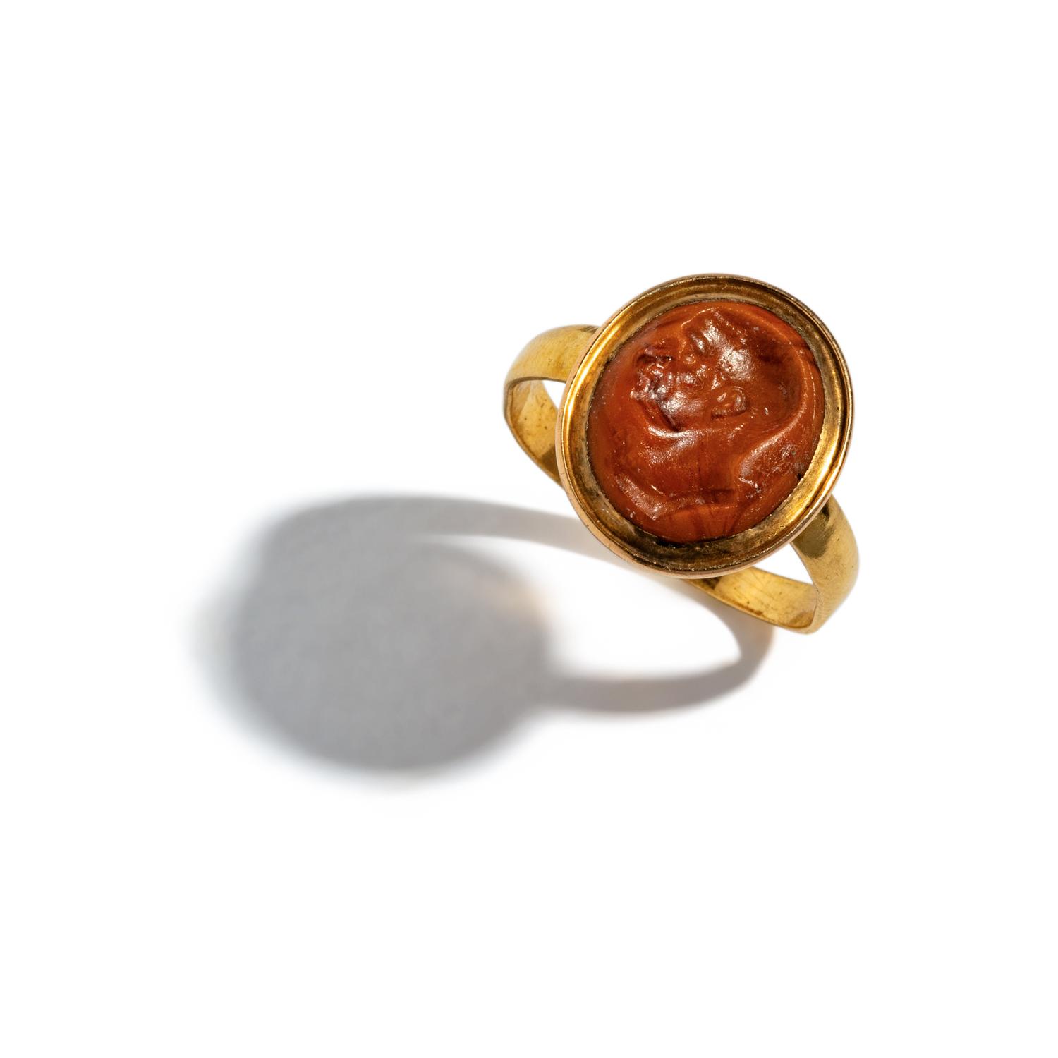 A Roman Glass Ring Stone with a Male Portrait Head — Set in a gold ring