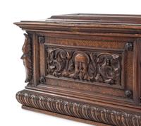 A Continental Carved Walnut Cassone