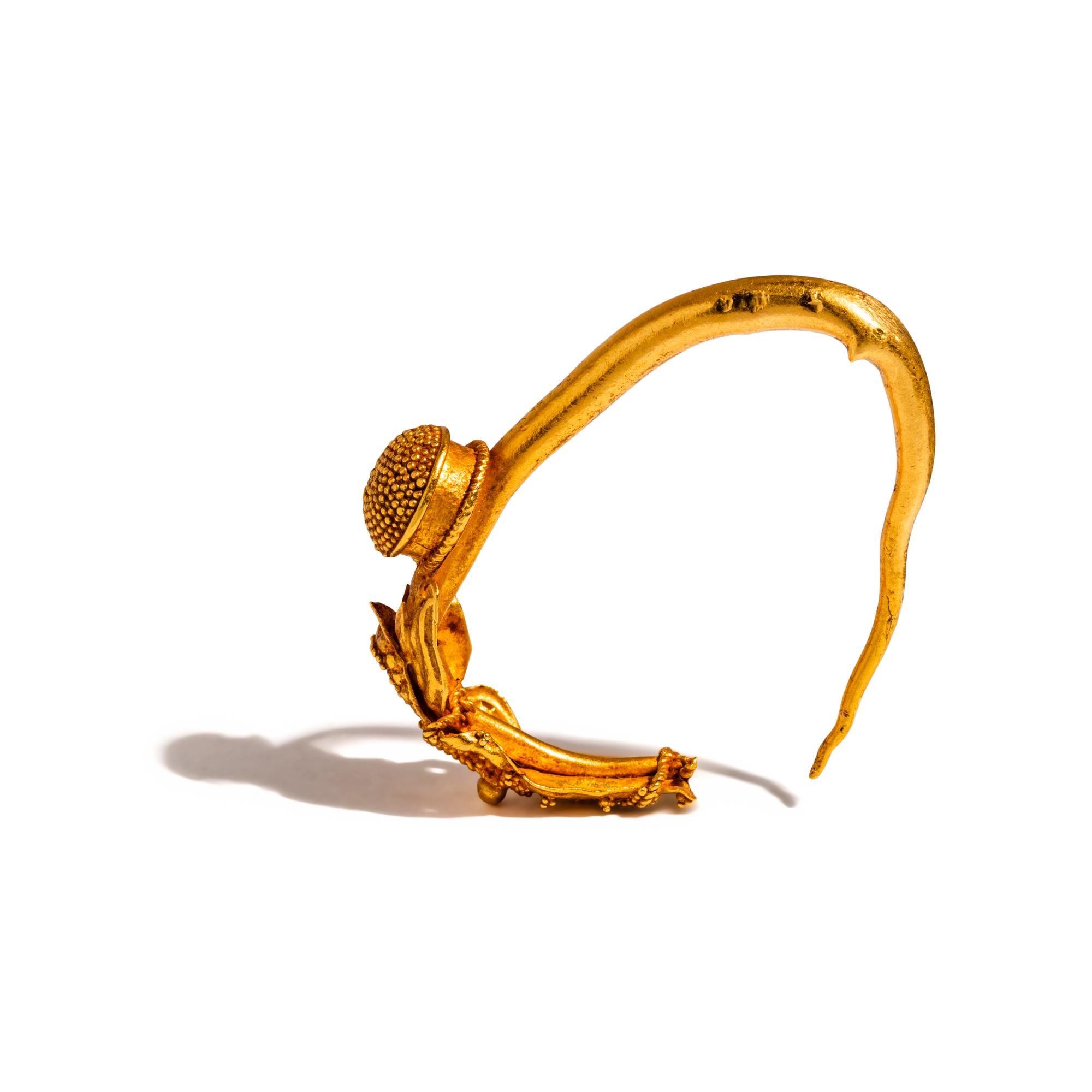A Greek Gold Earring with Winged Eros