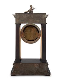An Empire Style Gilt Metal and Alabaster Mounted Ebonized Clock