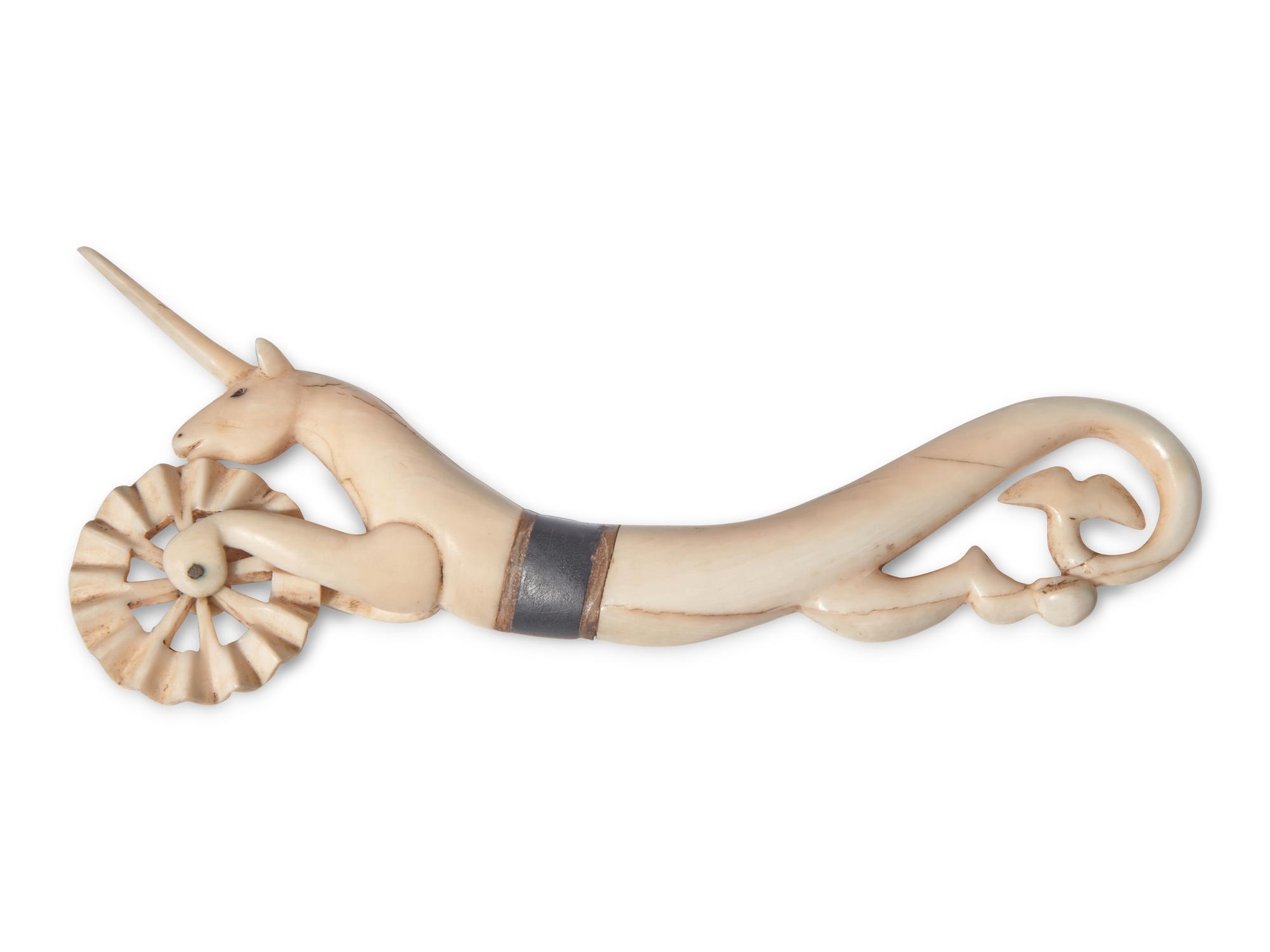 A Scrimshaw Carved Whale's Tooth Hippocampus-Form Pie Crimper, 19th Century