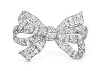 A Platinum and Diamond Bow Brooch, Austrian, 9.00 dwts.