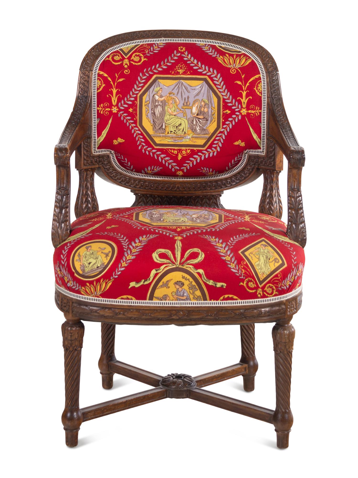 A Louis XVI Style Carved Armchair and Stool with Fortuny Upholstery