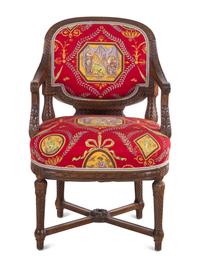 A Louis XVI Style Carved Armchair and Stool with Fortuny Upholstery