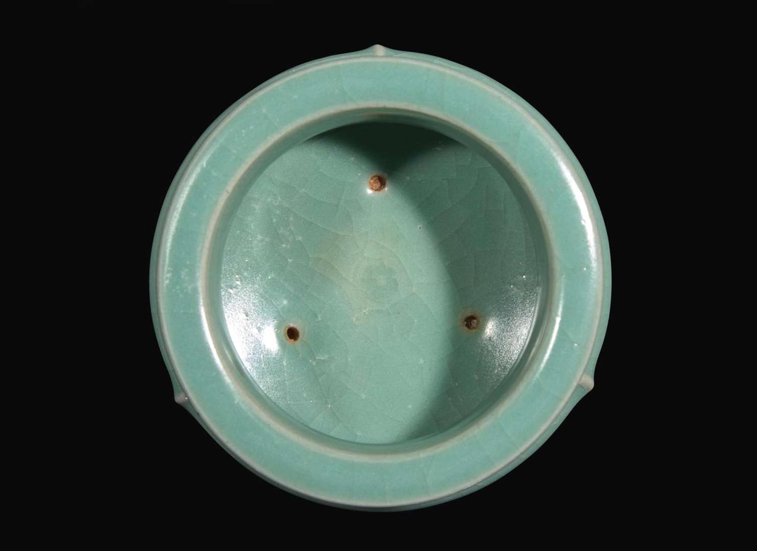 A celadon-glazed tripod censer 青瓷三足香爐