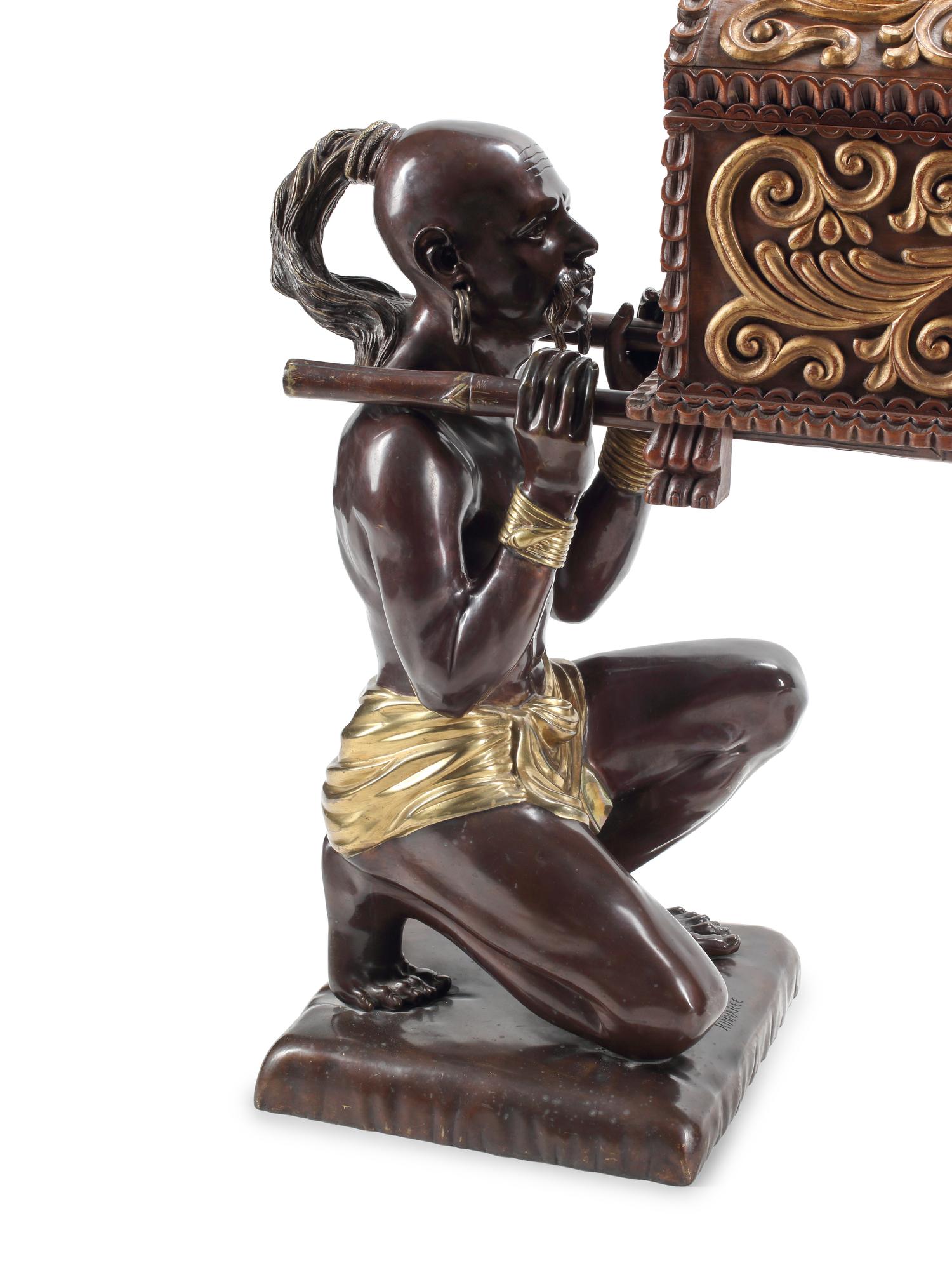 A Pair of Parcel-Gilt Bronze Kneeling Chinoiserie Figures with a Carved Wood Chest