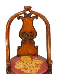 A Continental Parcel Ebonized Burled Walnut Music Chair