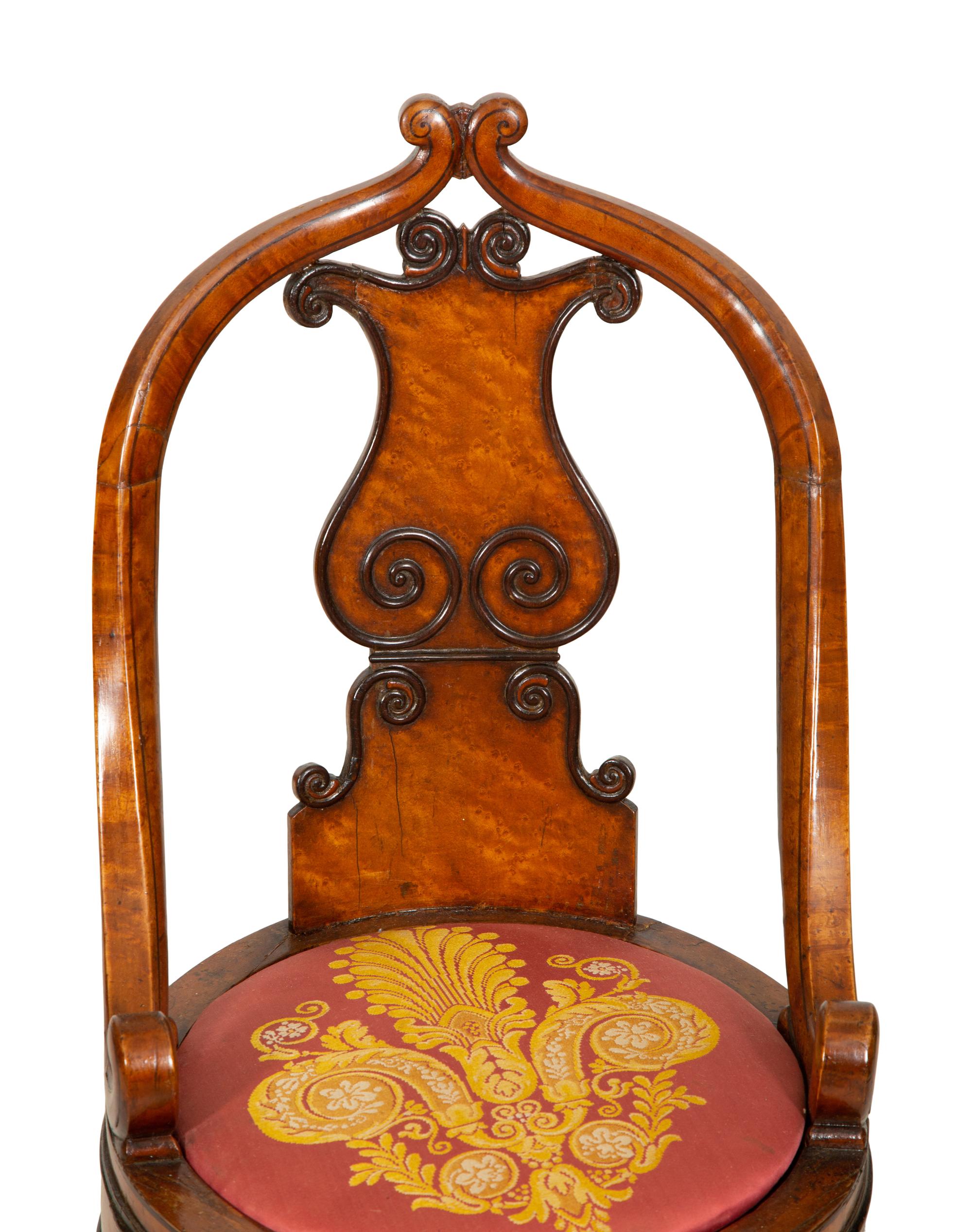 A Continental Parcel Ebonized Burled Walnut Music Chair