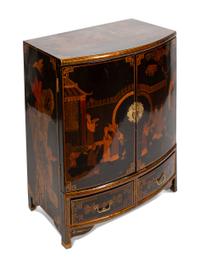 A Regency Style Black Japanned Bow-Front Cabinet