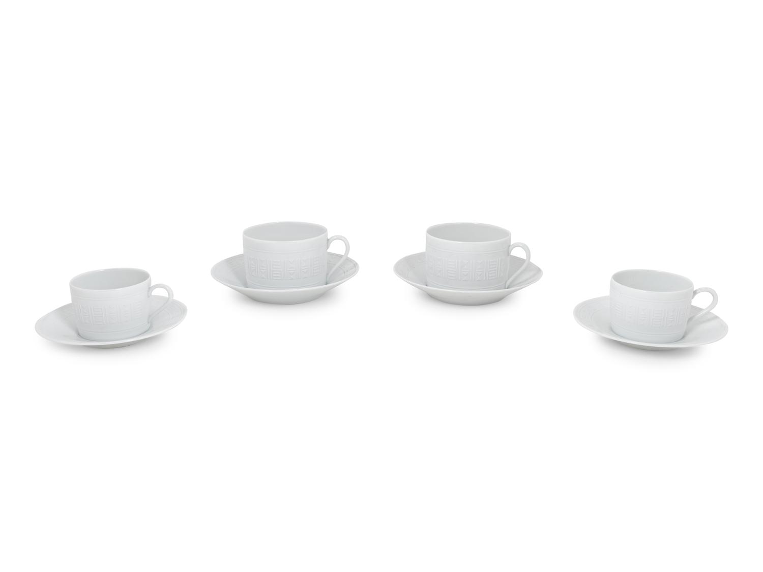 A Group of Hermès Egée Porcelain Cups and Saucers