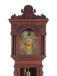 A Renaissance Revival Carved Walnut Tall Case Clock