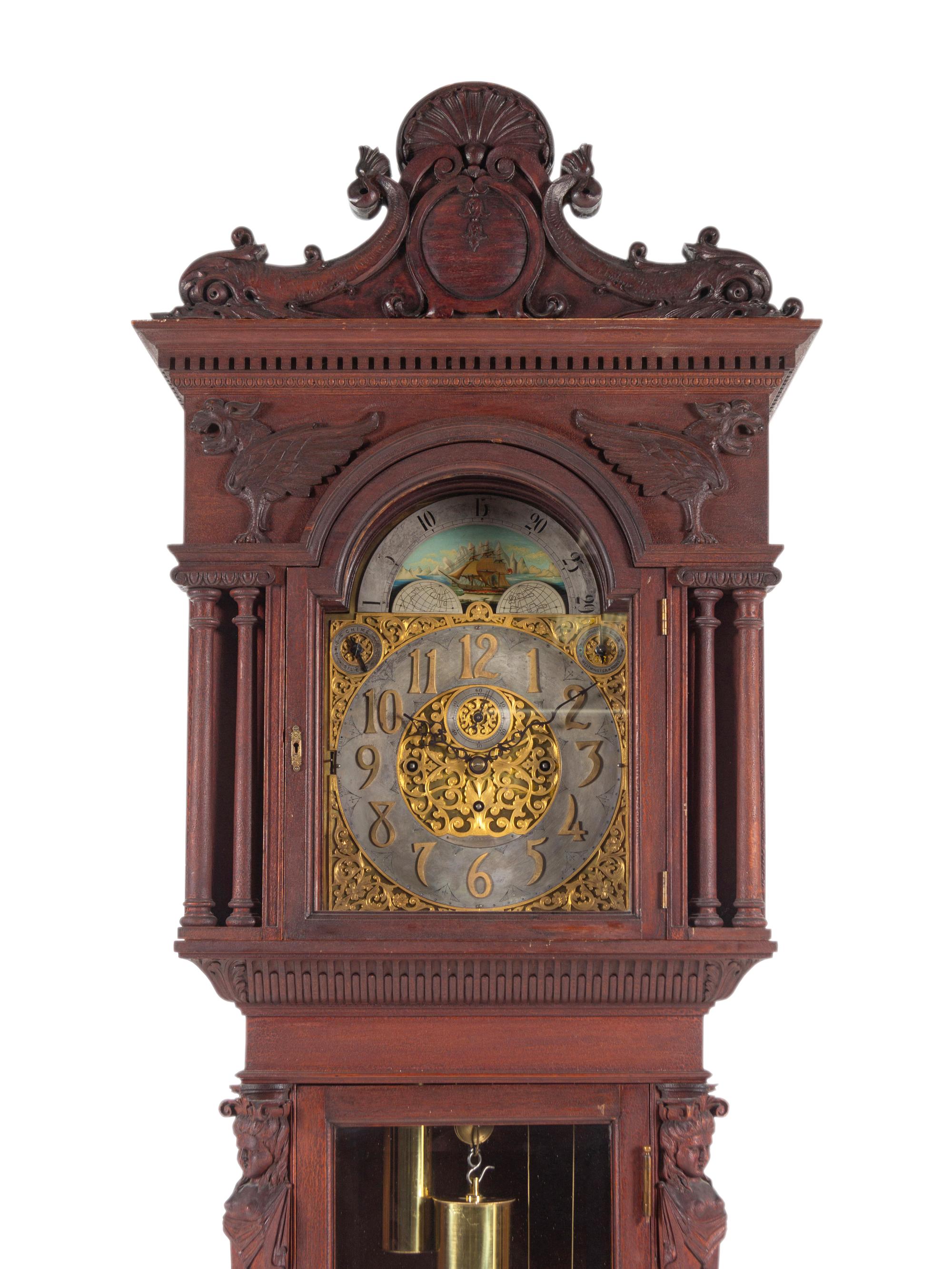 A Renaissance Revival Carved Walnut Tall Case Clock