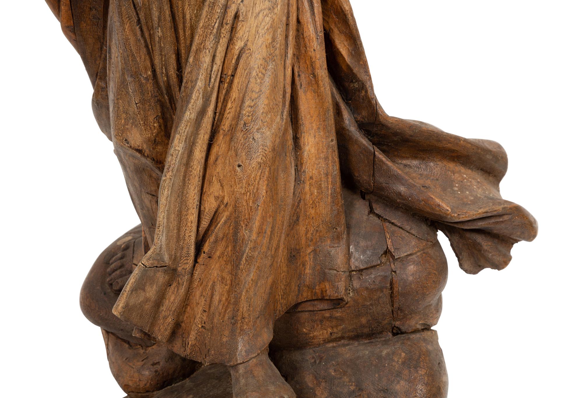 A Continental Carved Pine Figure of Female Saint