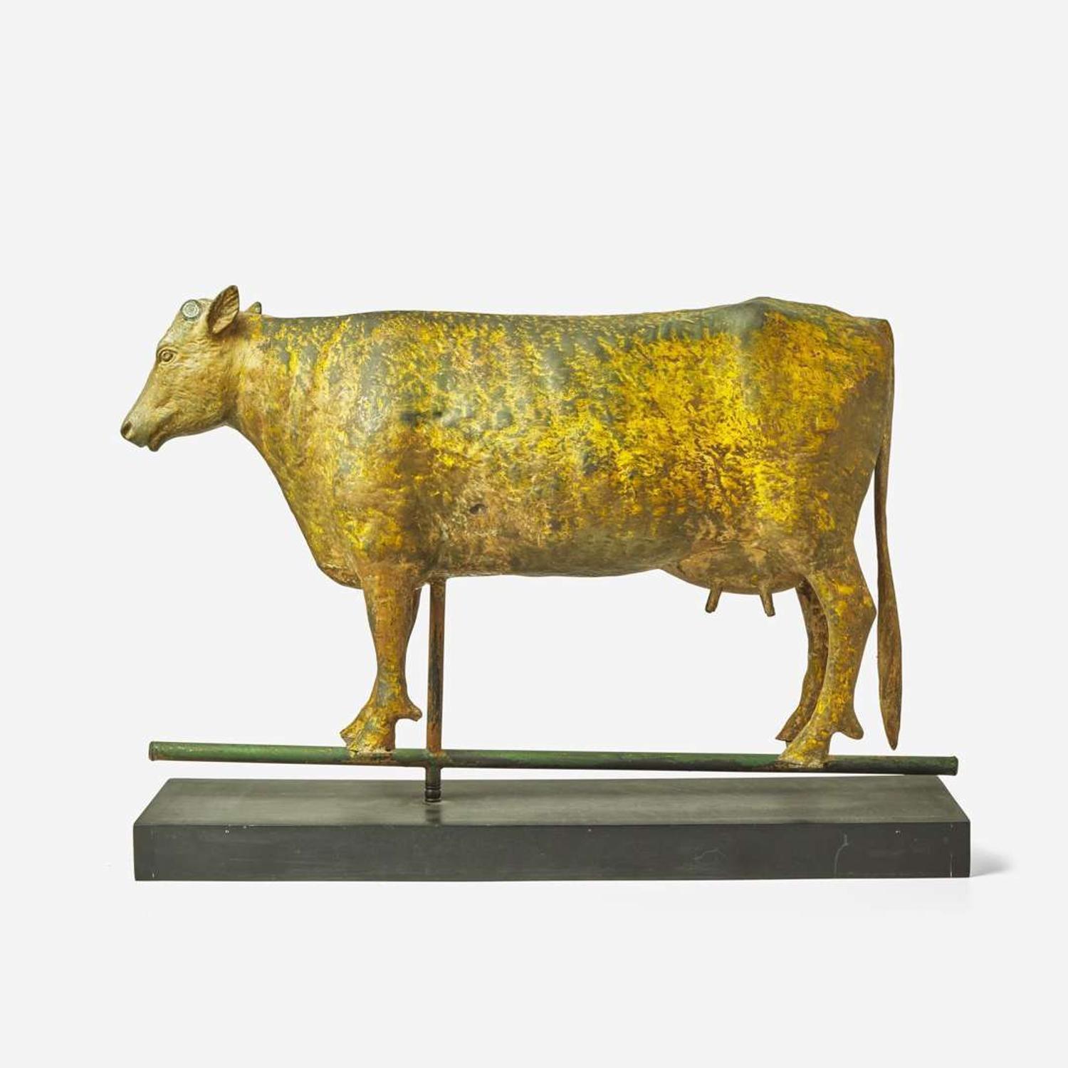A patinated and gilded copper weathervane of a cow