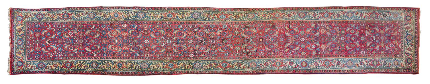 A Persian Wool Runner 18 feet 8 inches x 3 feet 8 inches. — EARLY TO MID 20TH CENTURY