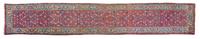 A Persian Wool Runner 18 feet 8 inches x 3 feet 8 inches. — EARLY TO MID 20TH CENTURY
