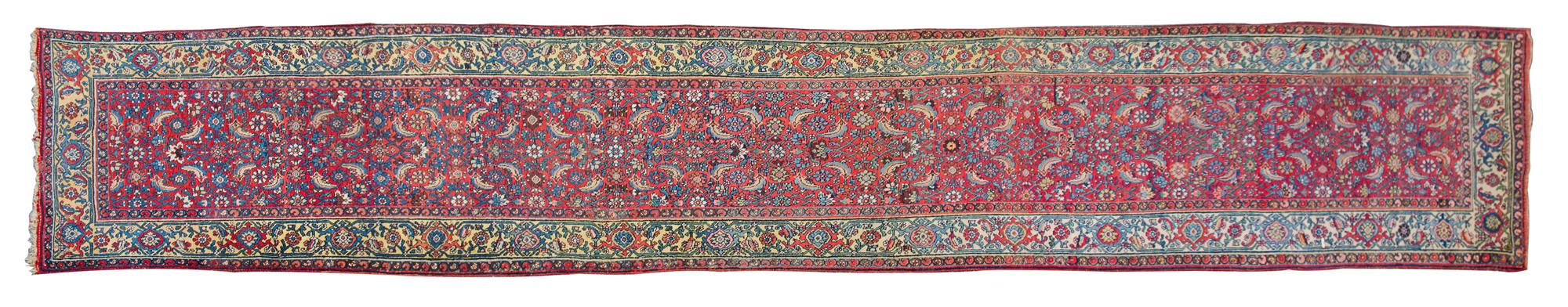 A Persian Wool Runner 18 feet 8 inches x 3 feet 8 inches. — EARLY TO MID 20TH CENTURY