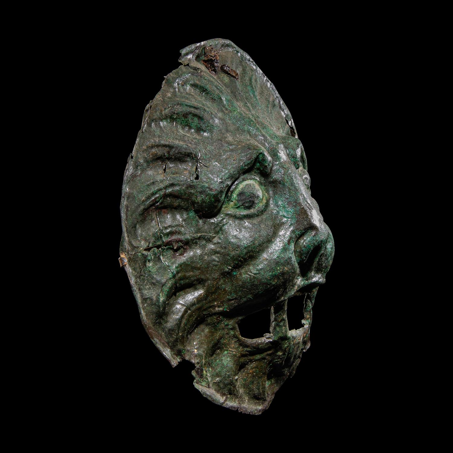 A Roman Bronze Sarcophagus Mask in the form of a Lion