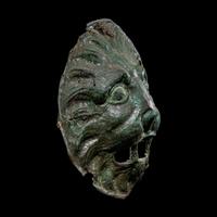 A Roman Bronze Sarcophagus Mask in the form of a Lion