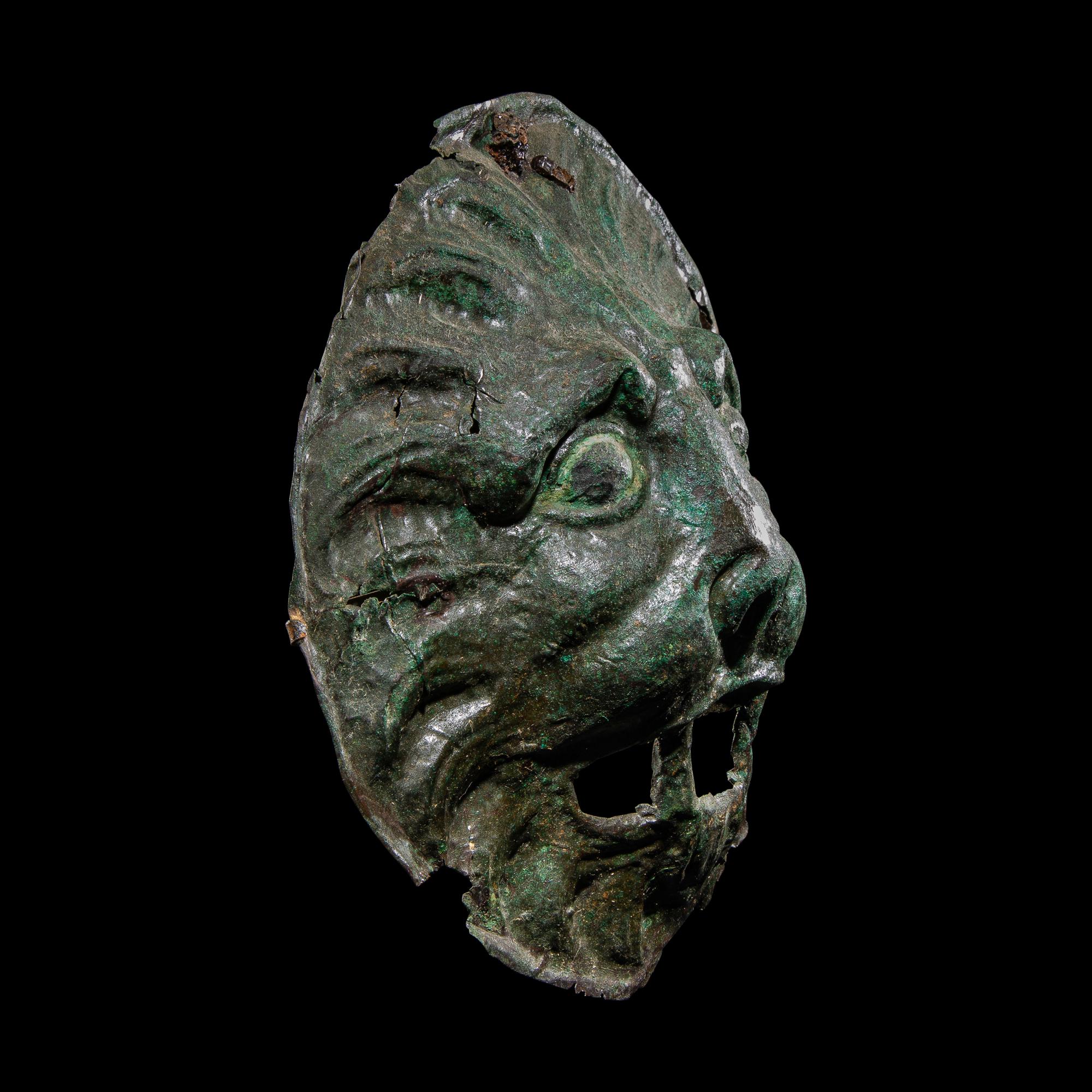 A Roman Bronze Sarcophagus Mask in the form of a Lion