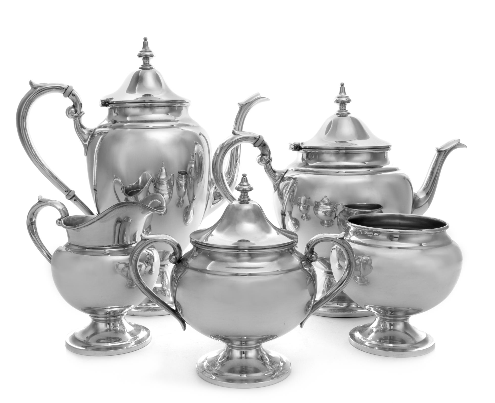 An American Silver Coffee and Tea Service, Gorham Mfg. Co., Providence, RI, in the Puritan pattern, comprising a coffee pot, a teapot,