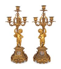 A Pair of French Gilt Bronze and Porcelain Inset Four-Light Candelabra