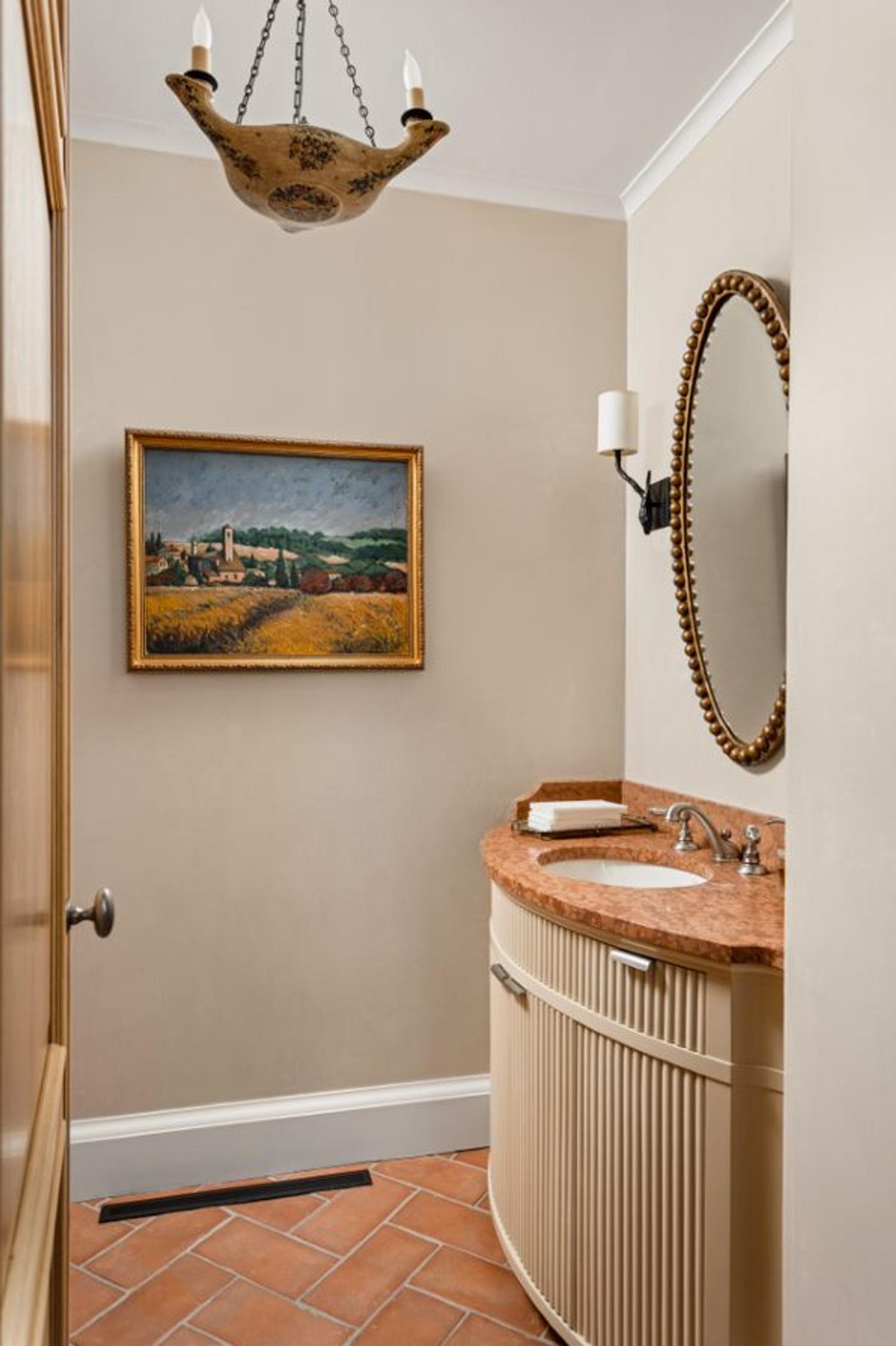A French Gold-Painted Oval Mirror