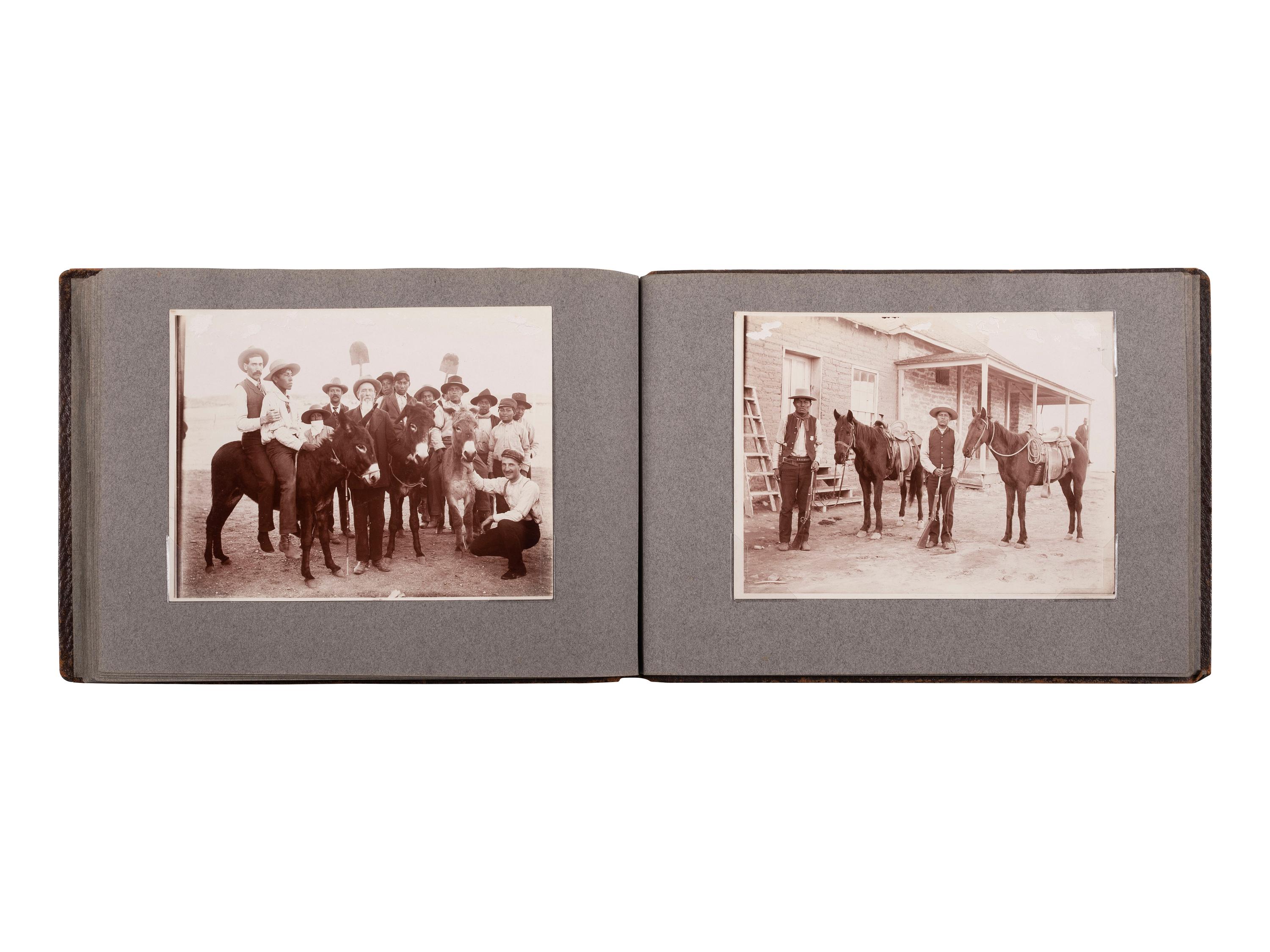 [NATIVE AMERICANS]. JONES, John Edward (1863-1922), photographer. Album containing 50 photographs of the San Carlos Indian Agency, including Apache civilians and police, agency buildings and dwellings, and scenic views. Ca 1904.