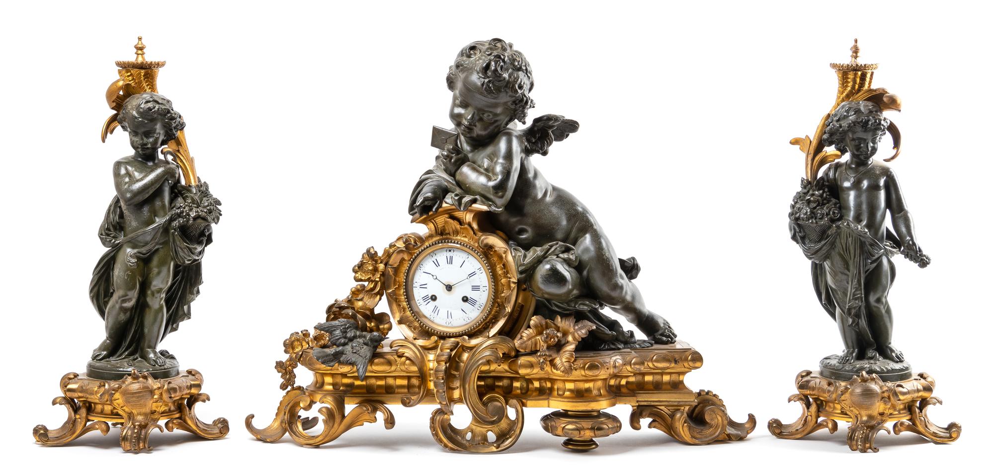 A Large French Gilt and Patinated Bronze Clock Garniture Height of mantel clock 24 x width 31 inches. — LATE 19TH CENTURY