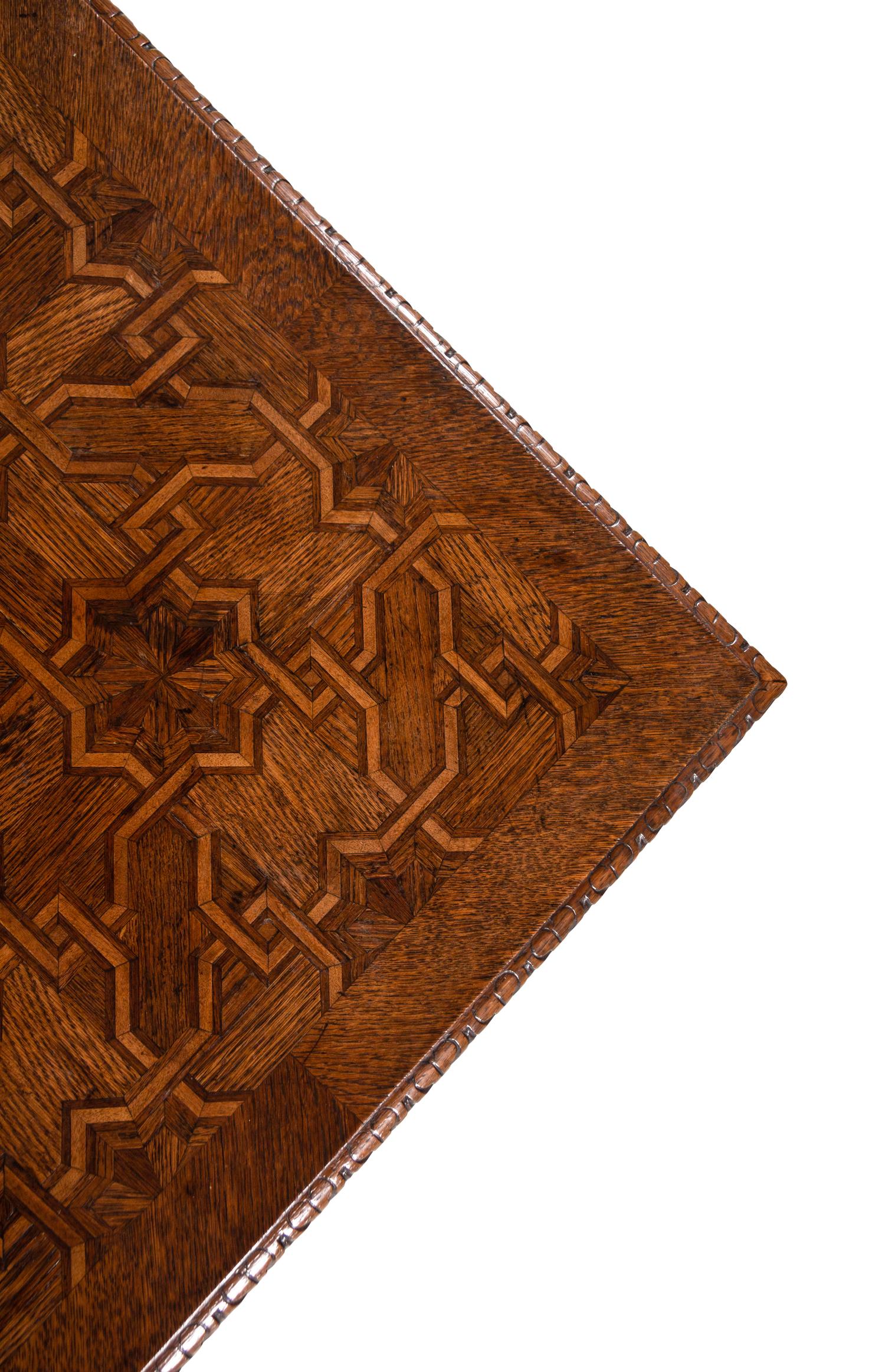 A Gothic Revival Walnut and Oak Parquetry Center Table by L. & S. Lövinson (German, active 19th Century)