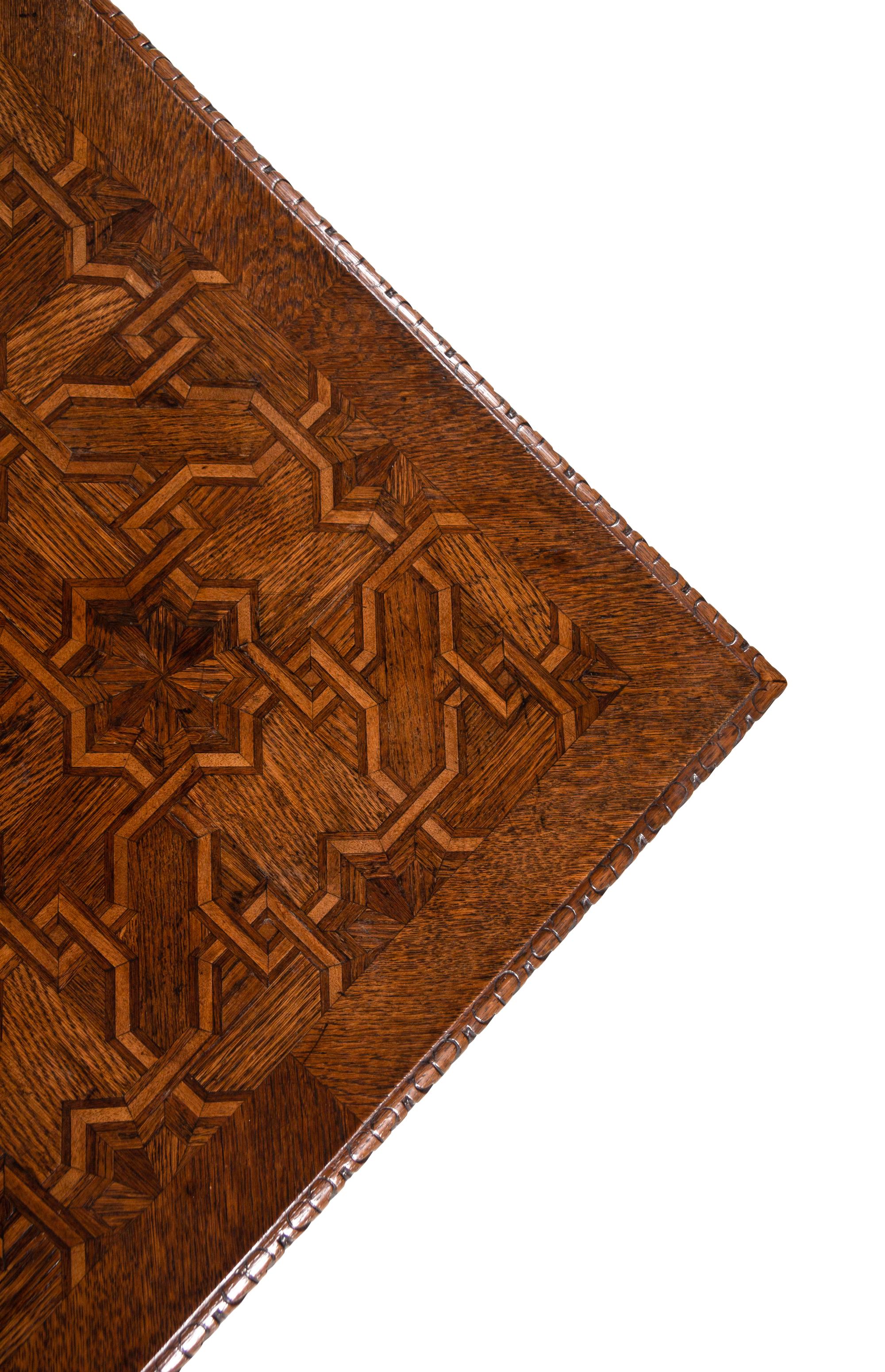 A Gothic Revival Walnut and Oak Parquetry Center Table by L. & S. Lövinson (German, active 19th Century)