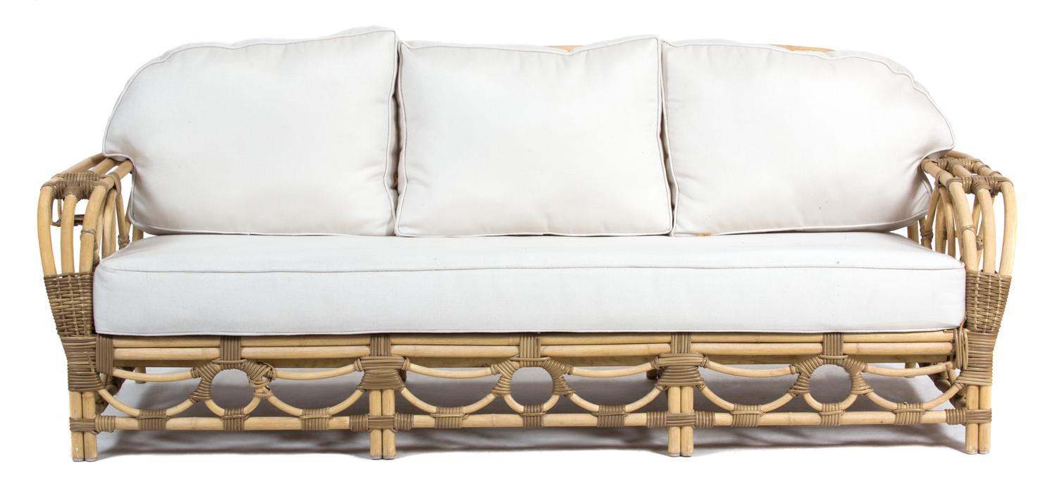 A Rattan Three Cushion Back and Seat Sofa Height 30 x length 84 inches. — 20TH CENTURY
