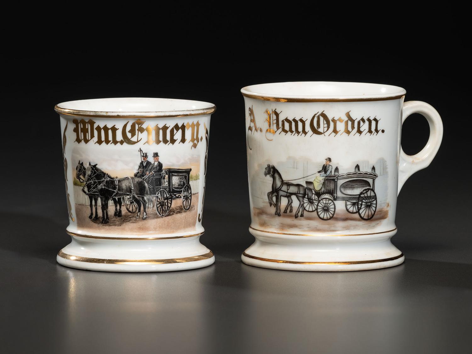 Two Porcelain Shaving Mugs Featuring Horse-Drawn Hearses