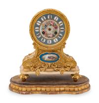 A Louis XVI Style Gilt Bronze and Sèvres Style Porcelain Inset Mantel Clock