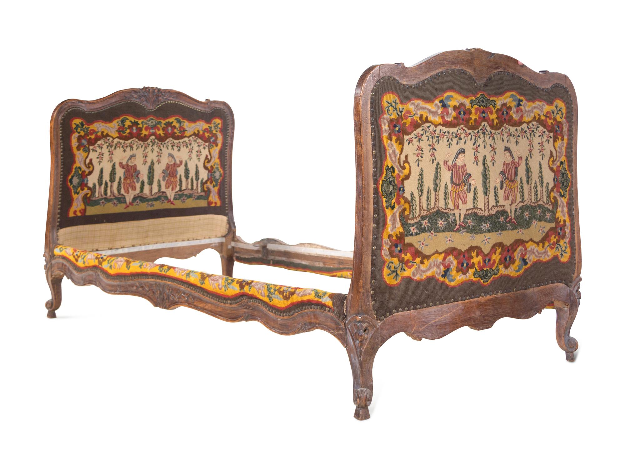 A French Provincial Carved Oak Bed with Needlepoint Upholstery