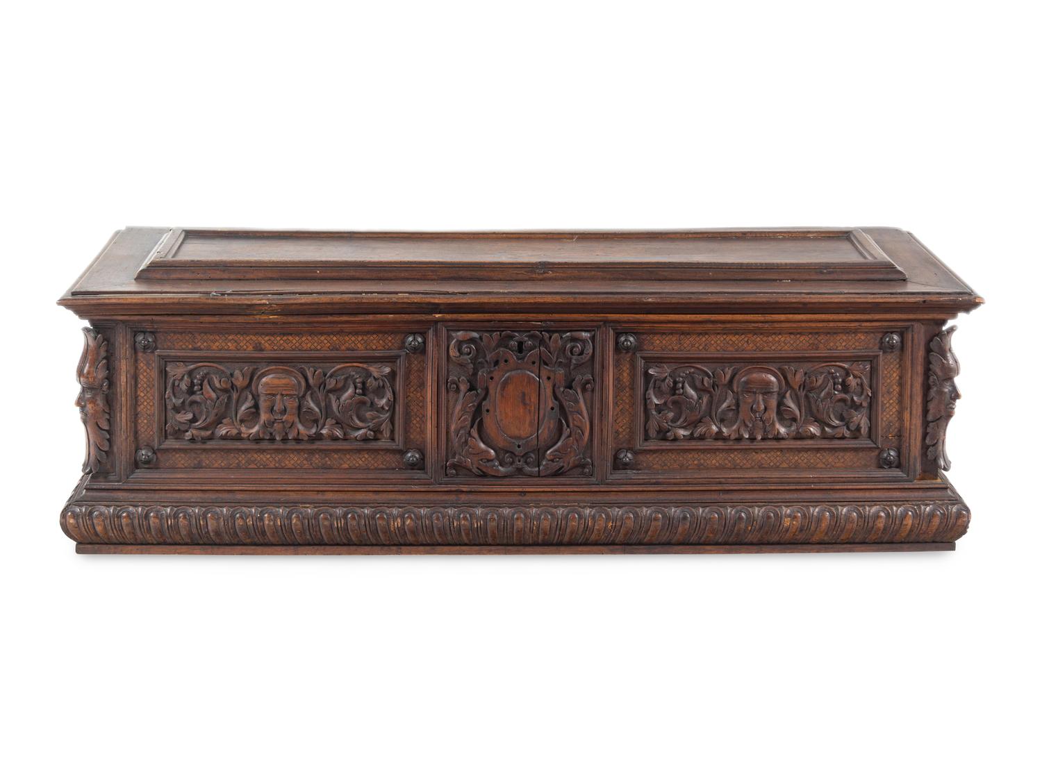 A Continental Carved Walnut Cassone