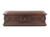 A Continental Carved Walnut Cassone