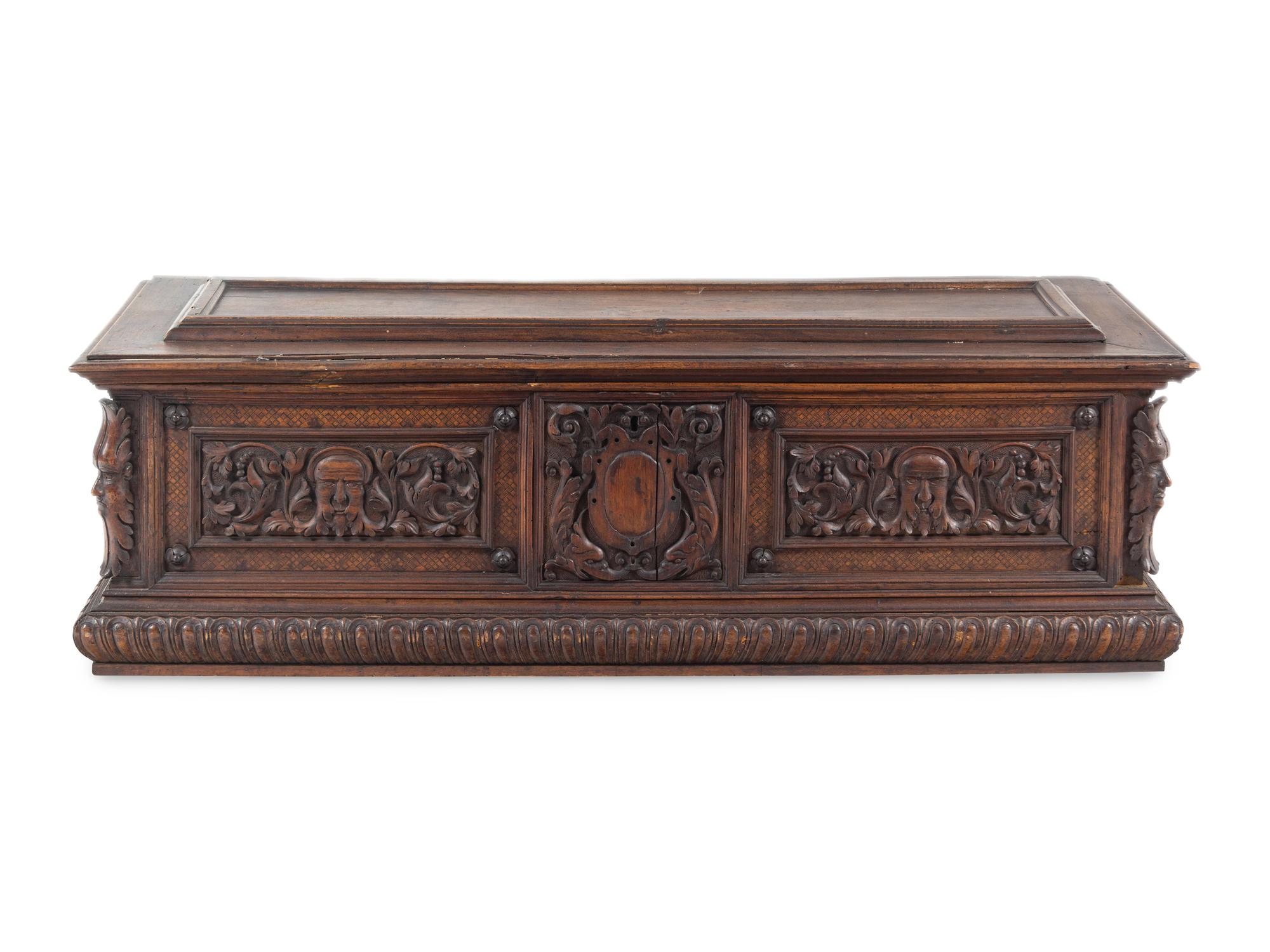 A Continental Carved Walnut Cassone