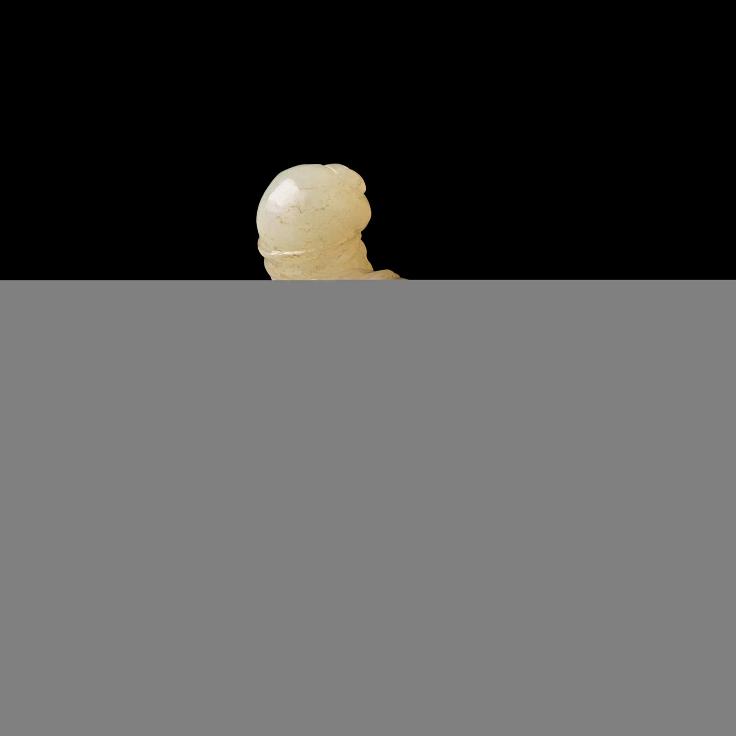 A Chinese Russet and White Jade Carved Foreigner 白玉帶沁胡人