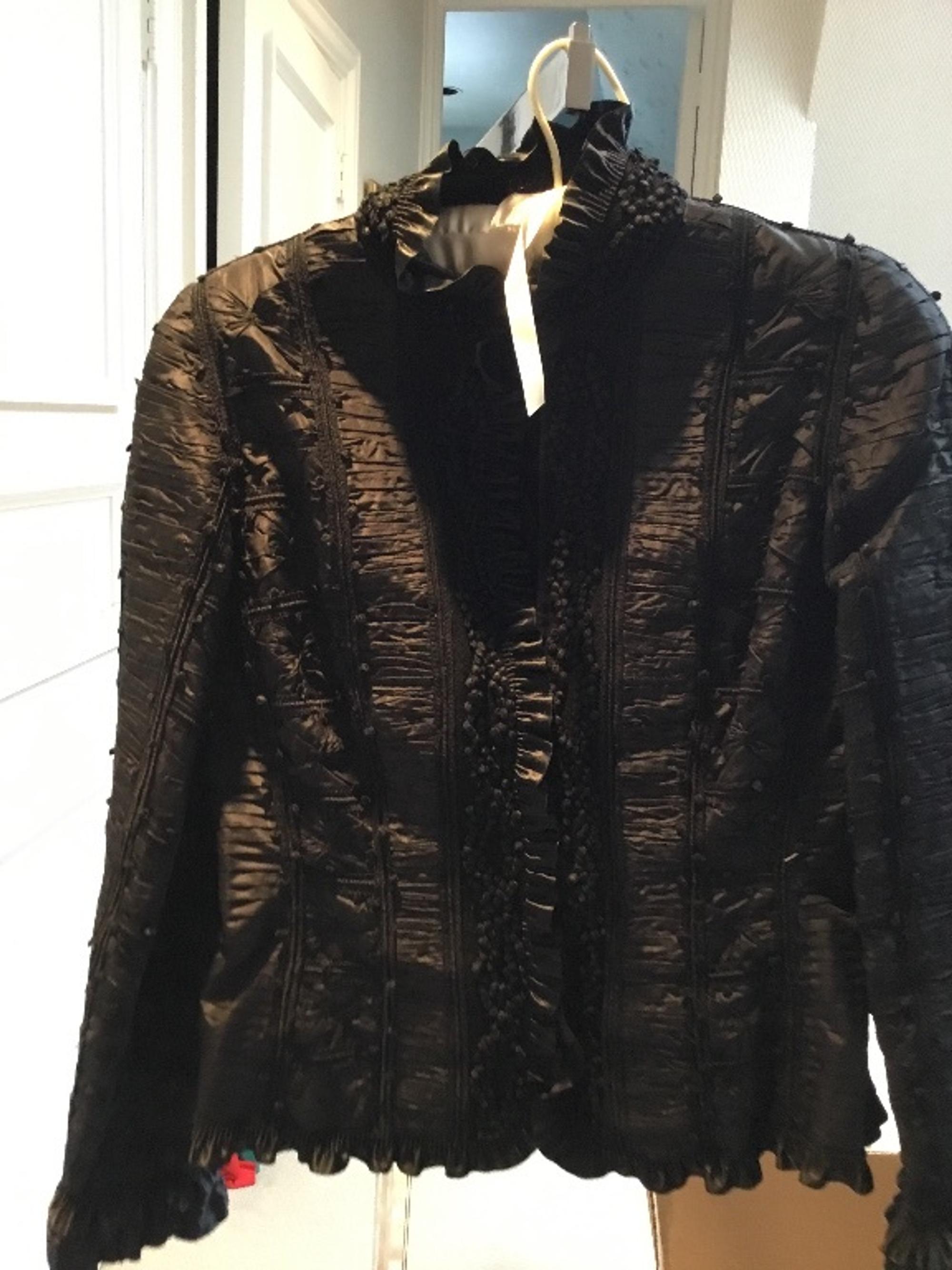 An Oscar de la Renta Black Silk Ruched Evening Jacket, Size 8.