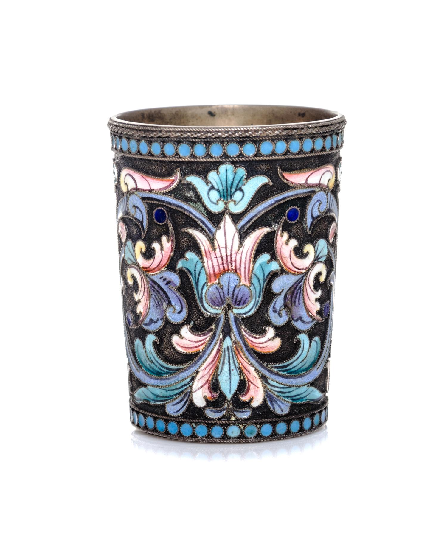 A Russian Silver and Enamel Liquor Glass, Moscow, 1908-1926, having polychrome foliate decoration throughout.