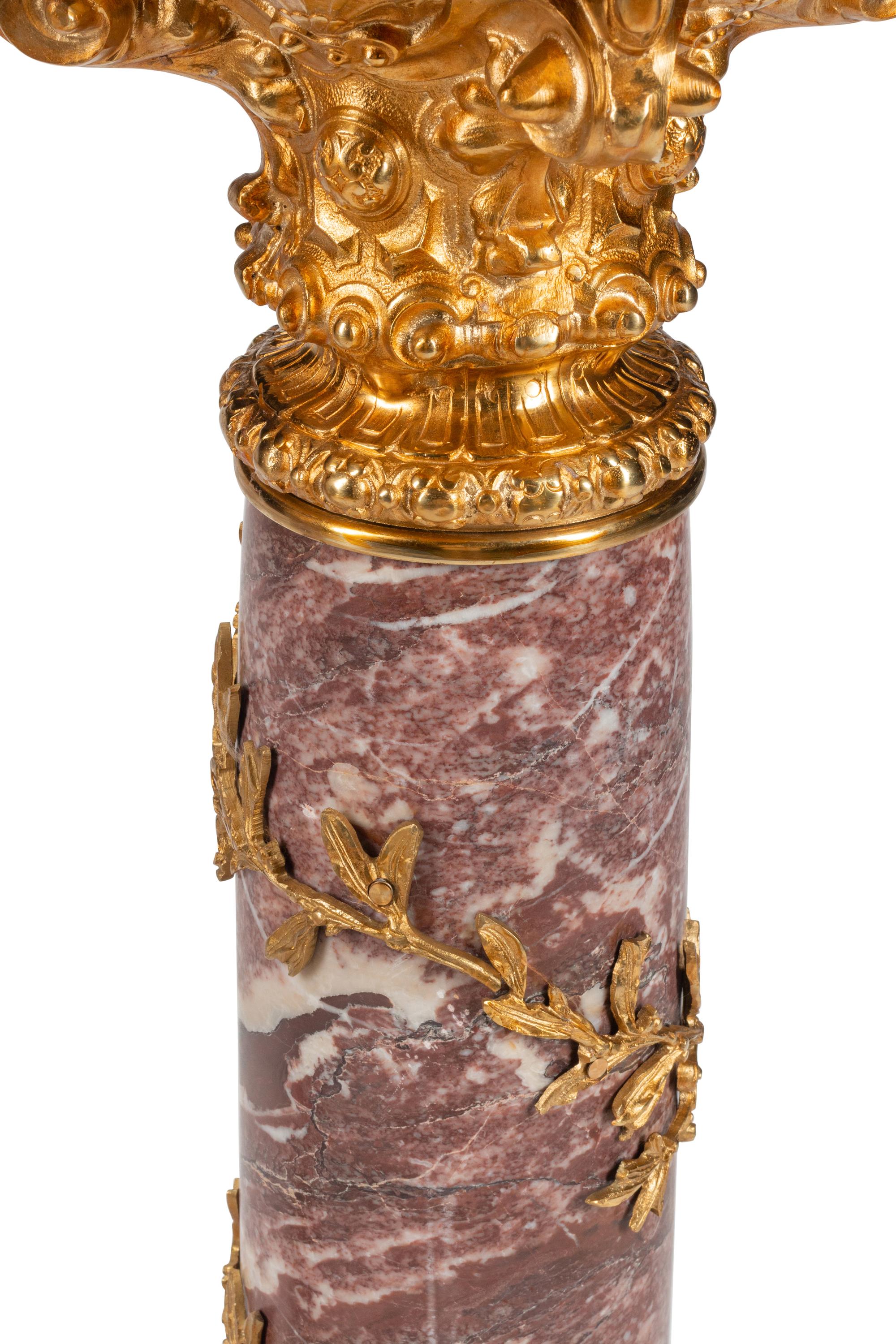A Pair of Continental Gilt Bronze Mounted Marble Pedestals